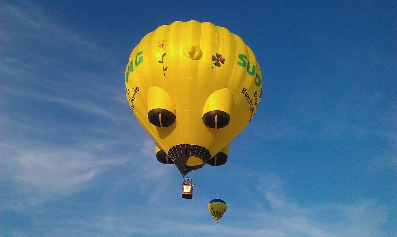 A yellow balloon - On a clear summer sky